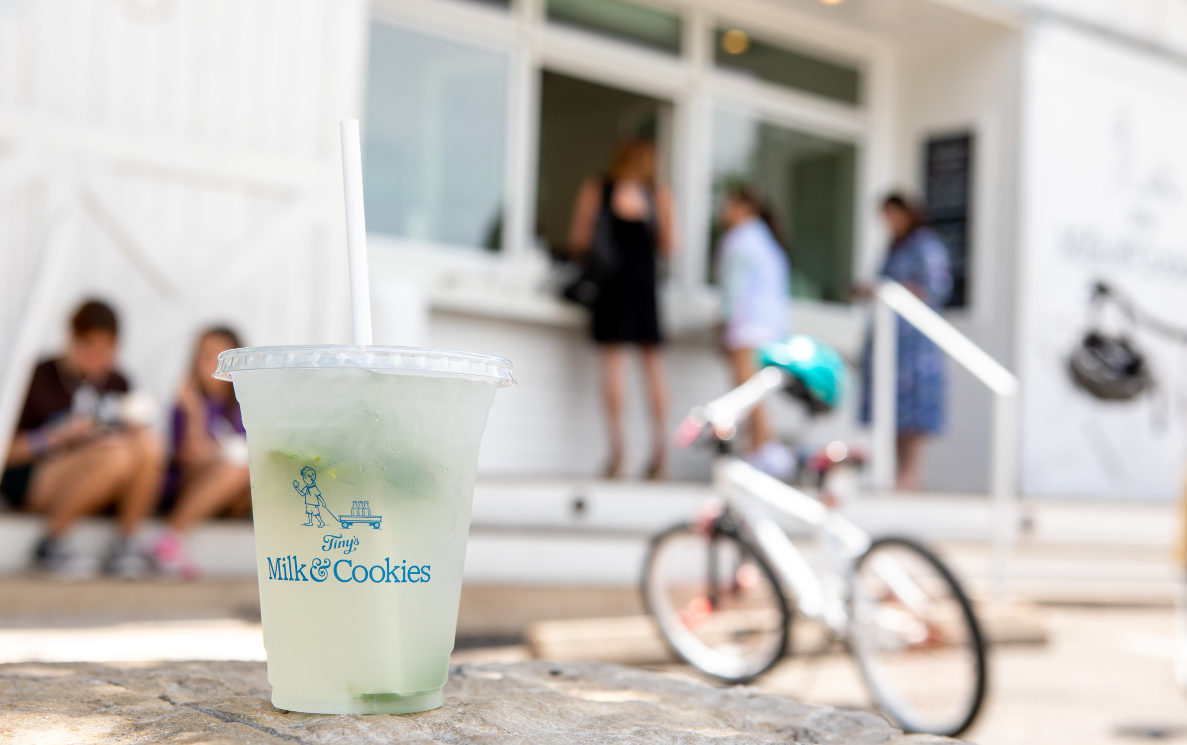 Austin exterior with lemonade and bike in focus