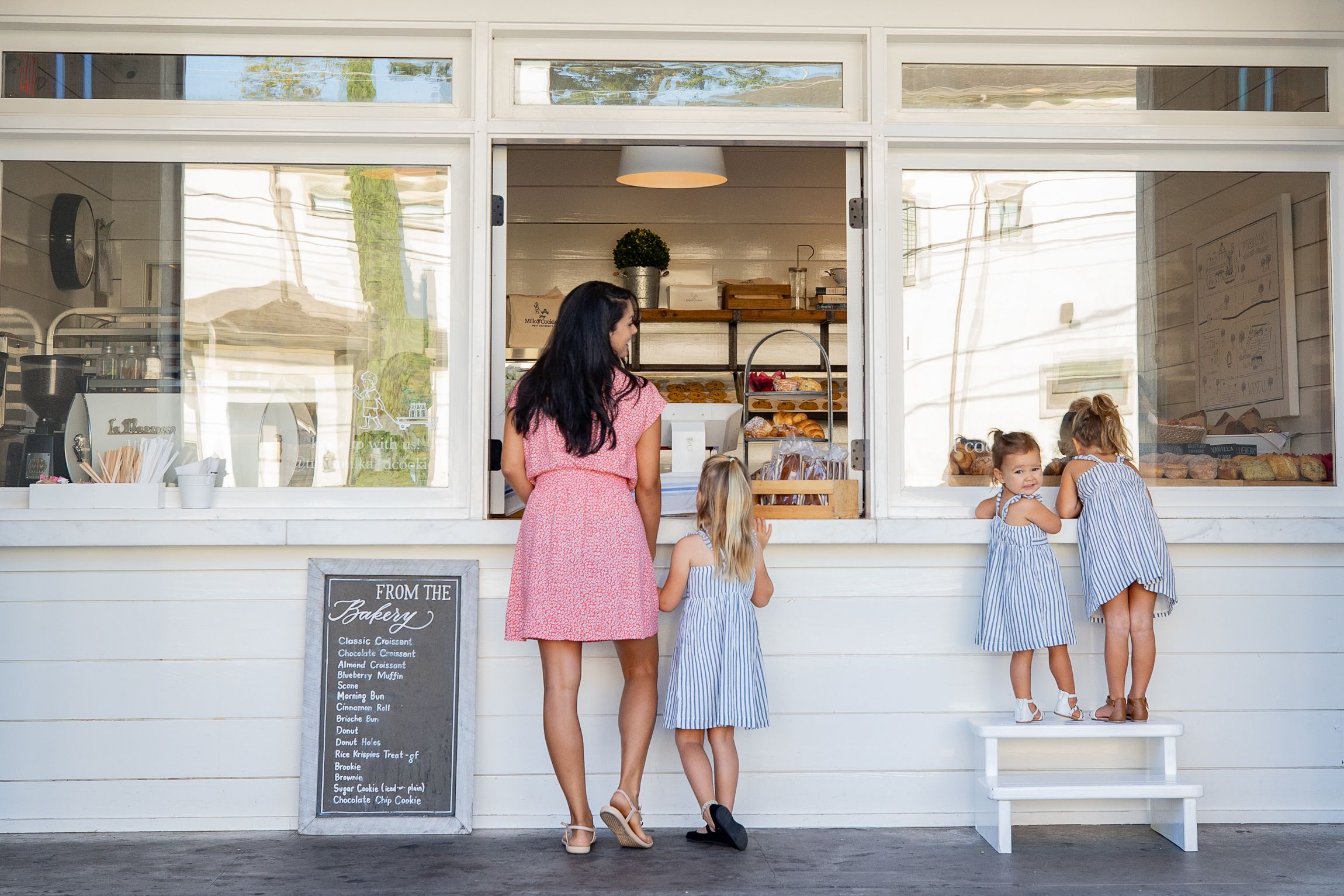 Mom and daughters at the counter