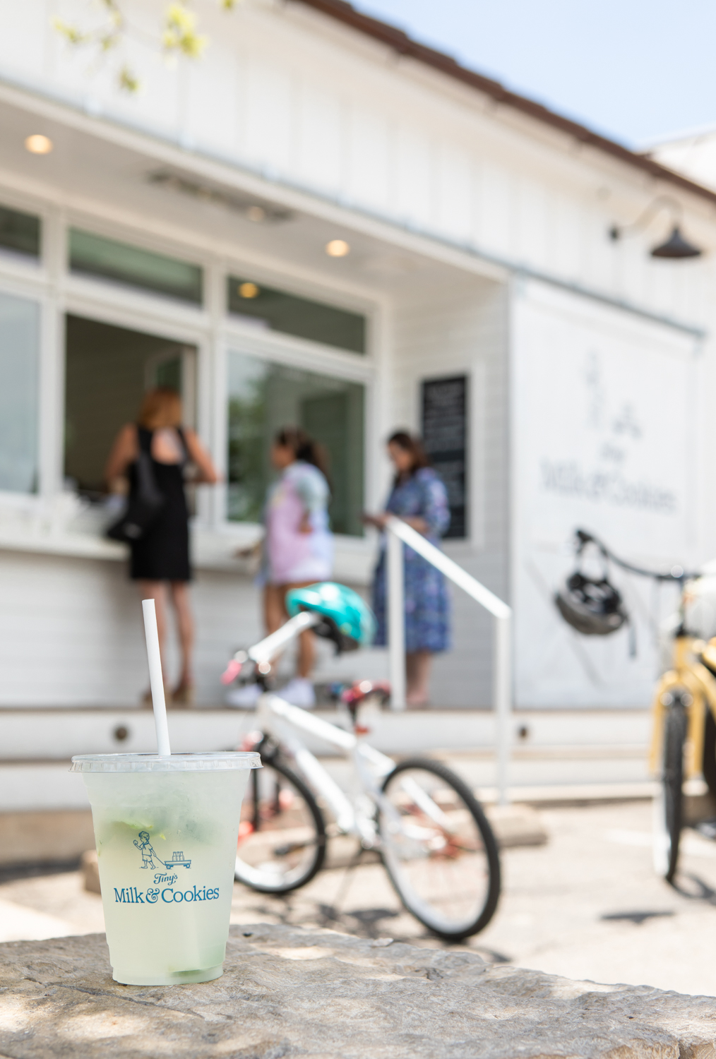 Austin exterior with lemonade and bike in focus