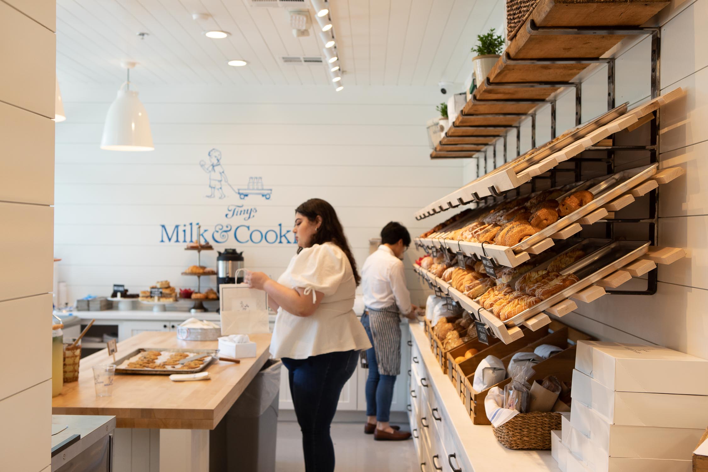 Staff in front of pastry wall